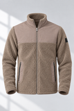 Giacca sherpa taupe su fondo grigio.png