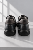 Sneaker NeroGiardini in pelle scura.png